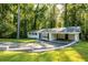 Charming single-story home boasting a carport, a well-manicured lawn, and beautiful curb appeal at 4704 Apache Sw Trl, Atlanta, GA 30331