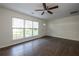 Spacious living room with hardwood floors, large windows, and a neutral color palette for a bright and inviting atmosphere at 4704 Apache Sw Trl, Atlanta, GA 30331