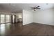 Hardwood floors and an open layout connect the living area to a modern kitchen with stainless steel appliances at 4704 Apache Sw Trl, Atlanta, GA 30331