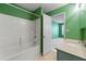 Bathroom with tub, tile, and shower. A door leads to another room at 4980 W Chapel Hill Rd, Douglasville, GA 30135
