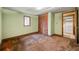 Bedroom with a laundry room and a closet featuring carpeted floor and light green walls at 4980 W Chapel Hill Rd, Douglasville, GA 30135