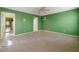 Spacious bedroom with carpet flooring, and a view to the adjacent room through the doorway at 4980 W Chapel Hill Rd, Douglasville, GA 30135