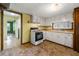 Kitchen featuring an oven and cooktop, laminate counters, and view of an adjacent room at 4980 W Chapel Hill Rd, Douglasville, GA 30135