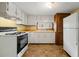 Kitchen with white cabinets, an oven, laminate countertops, and a window over the sink at 4980 W Chapel Hill Rd, Douglasville, GA 30135