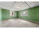 Bright living room featuring green walls and natural light from lattice windows at 4980 W Chapel Hill Rd, Douglasville, GA 30135