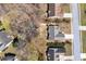 Aerial view of a home situated in a residential neighborhood with mature trees and landscaping at 1545 Heatherton Rd, Dacula, GA 30019
