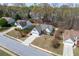 Overhead shot of a home with a well-manicured lawn in a suburban neighborhood setting at 1545 Heatherton Rd, Dacula, GA 30019