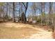 Spacious backyard featuring mature trees and landscape potential at 1545 Heatherton Rd, Dacula, GA 30019
