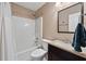 Clean bathroom features a shower, bathtub, and a dark wood vanity providing a functional space at 1545 Heatherton Rd, Dacula, GA 30019
