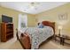 Cozy bedroom features a ceiling fan and neutral color palette to create a peaceful and relaxing space at 1545 Heatherton Rd, Dacula, GA 30019