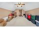 Large bonus room with a ceiling fan and window, with neutral carpet and lots of storage at 1545 Heatherton Rd, Dacula, GA 30019