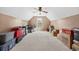 Large bonus room with a ceiling fan and window, with neutral carpet and lots of storage at 1545 Heatherton Rd, Dacula, GA 30019
