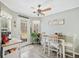Bright dining area features a table with seating, a door to the outside, and lots of natural light at 1545 Heatherton Rd, Dacula, GA 30019