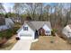 Well-kept home featuring a two-car garage, manicured lawn, and classic architectural elements at 1545 Heatherton Rd, Dacula, GA 30019