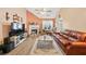 Comfortable living room featuring a fireplace, high ceilings, wood flooring and lots of natural light at 1545 Heatherton Rd, Dacula, GA 30019