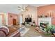 Comfortable living room featuring a fireplace, high ceilings, wood flooring and lots of natural light at 1545 Heatherton Rd, Dacula, GA 30019