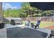Private backyard with a spa, patio seating, lush landscaping, and a hammock strung up between trees at 2240 Arnold Mill Nw Rd, Lawrenceville, GA 30044