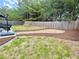 This backyard includes a hammock, a mulch garden, lawn and tall mature trees at 2240 Arnold Mill Nw Rd, Lawrenceville, GA 30044