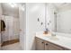 This bathroom has a bath/shower, vanity with mirror, and a neutral color palette at 2240 Arnold Mill Nw Rd, Lawrenceville, GA 30044