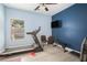 Home gym with treadmill, weight bench, and mounted television for convenient workouts at 2240 Arnold Mill Nw Rd, Lawrenceville, GA 30044