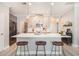 Modern kitchen with marble countertops, pendant lighting, stainless steel appliances, and three bar stools at 2240 Arnold Mill Nw Rd, Lawrenceville, GA 30044