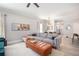 Spacious living room with contemporary furnishings, open layout, and a view to the dining and kitchen areas at 2240 Arnold Mill Nw Rd, Lawrenceville, GA 30044