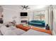 Bright and open living room featuring comfortable seating, decorative fireplace, and large windows at 2240 Arnold Mill Nw Rd, Lawrenceville, GA 30044