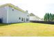 Expansive backyard with lush lawn and a paved patio, great for outdoor entertaining and activities at 3903 Cain Mill Dr, Lithonia, GA 30038