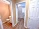 This half bathroom provides an updated sink, flooring, and fresh paint at 3903 Cain Mill Dr, Lithonia, GA 30038