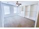 Bedroom featuring carpeted floors and a wall of custom closet organizers with shelving and drawers at 3903 Cain Mill Dr, Lithonia, GA 30038