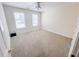 Neutral bedroom with two windows and a ceiling fan at 3903 Cain Mill Dr, Lithonia, GA 30038