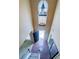 Grand two-story foyer with hardwood floors, a decorative chandelier, and a view of the front door at 3903 Cain Mill Dr, Lithonia, GA 30038