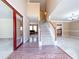 Elegant foyer showcasing wood floors, a staircase, and a view into the living area at 3903 Cain Mill Dr, Lithonia, GA 30038