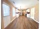 Open kitchen features white cabinets, stainless appliances, and hardwood floors providing an eat-in dining space at 3903 Cain Mill Dr, Lithonia, GA 30038