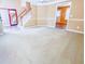 Spacious living room with neutral carpet, fresh paint, and natural light at 3903 Cain Mill Dr, Lithonia, GA 30038