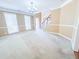 Bright living room area featuring light fixtures, fresh paint, and new carpet at 3903 Cain Mill Dr, Lithonia, GA 30038