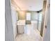 Main bathroom with dual sinks, a separate tub, and a glass-enclosed shower at 3903 Cain Mill Dr, Lithonia, GA 30038