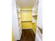 Walk-in closet with custom shelving and laminate flooring provides ample storage and organization at 3903 Cain Mill Dr, Lithonia, GA 30038
