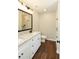 Bathroom features double sinks with granite countertops and a walk-in shower at 482 West Ave, Bowdon, GA 30108