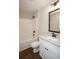 Well-lit bathroom featuring a shower-tub combo and a granite-topped vanity with modern fixtures at 482 West Ave, Bowdon, GA 30108