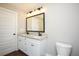 Bathroom features double sinks with granite countertops and a walk-in shower at 482 West Ave, Bowdon, GA 30108