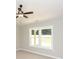 Bedroom with a ceiling fan, a window with a view, and carpet flooring at 482 West Ave, Bowdon, GA 30108