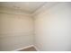Walk-in closet with shelving and carpet flooring at 482 West Ave, Bowdon, GA 30108