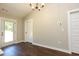 Dining area featuring hardwood floors and an open plan layout at 482 West Ave, Bowdon, GA 30108