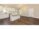 Eat-in kitchen with granite countertops, stainless appliances, and hardwood floors at 482 West Ave, Bowdon, GA 30108