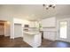 Modern kitchen with white cabinets, granite counters, stainless steel appliances, and an island at 482 West Ave, Bowdon, GA 30108