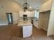 Bright kitchen boasts granite countertops, white cabinetry, and stainless steel appliances at 482 West Ave, Bowdon, GA 30108