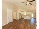 Open-concept living room and kitchen with modern fixtures, wood floors, and ample natural light at 482 West Ave, Bowdon, GA 30108