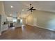 Bright, open floor plan with vaulted ceilings and stylish light fixtures over the kitchen island at 482 West Ave, Bowdon, GA 30108