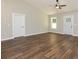 Spacious living room with vaulted ceiling, hardwood floors, and natural light at 482 West Ave, Bowdon, GA 30108
